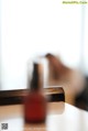 A bottle of nail polish sitting on top of a table.