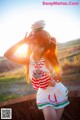 A woman in a sailor outfit posing for a picture.