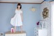 A woman standing on top of a dresser in a room.