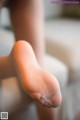 A close up of a person's foot with a pair of socks.