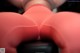A close up of a woman's butt in red tights.