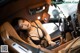 A woman sitting in the driver's seat of a car.