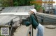 A woman standing on top of a metal railing.